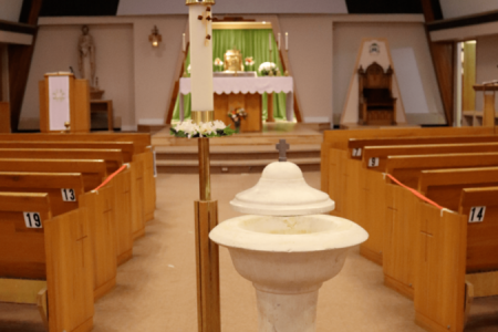Baptismal font and Paschal Candle